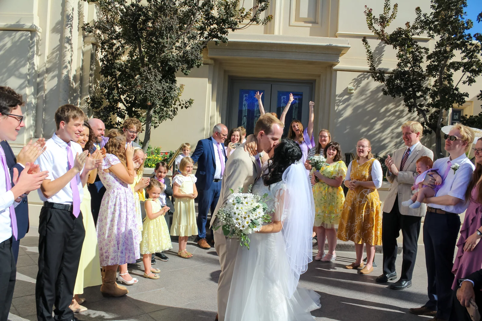 Family celebrating with the newly married couple